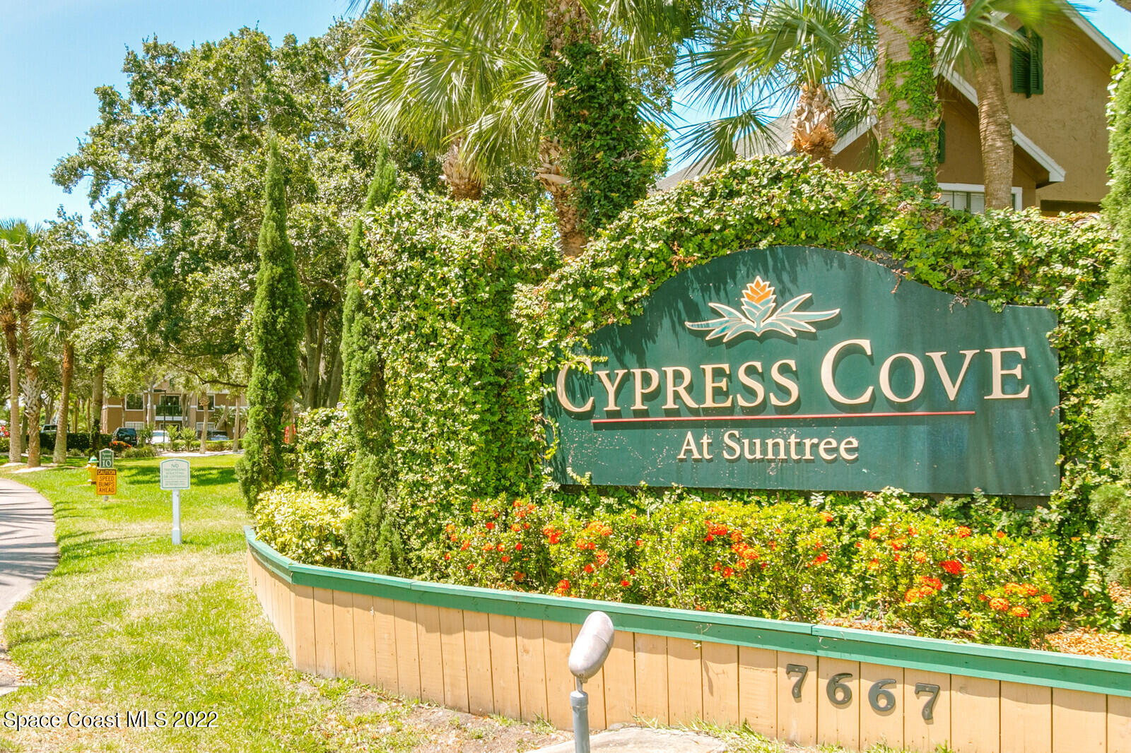 7667 North Wickham Road, Unit 418 Melbourne, FL 32940 - Photo 2 of 36 a sign on the side of a building