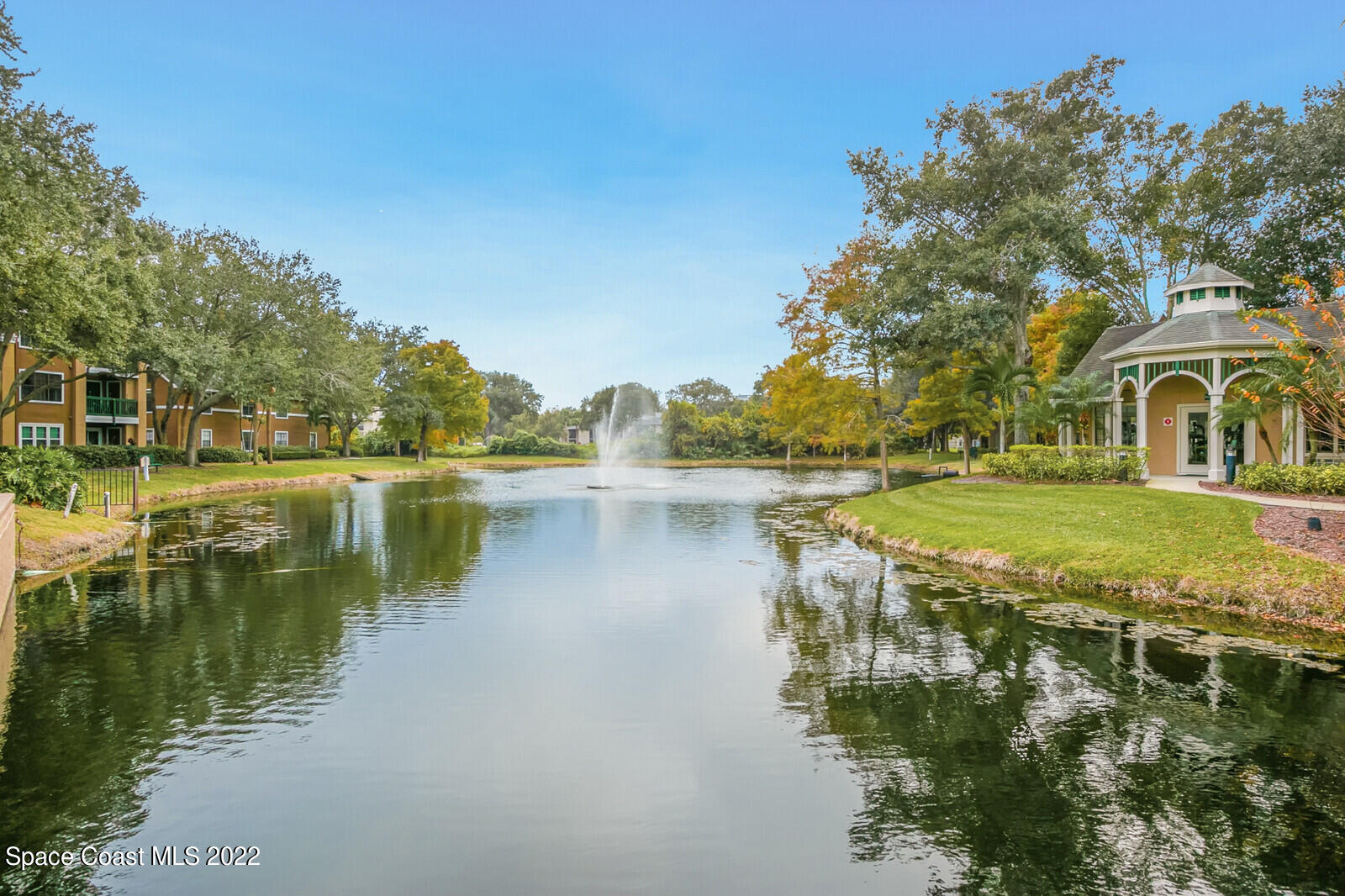 7667 North Wickham Road, Unit 418 Melbourne, FL 32940 - Photo 23 of 36 a view of a lake with houses