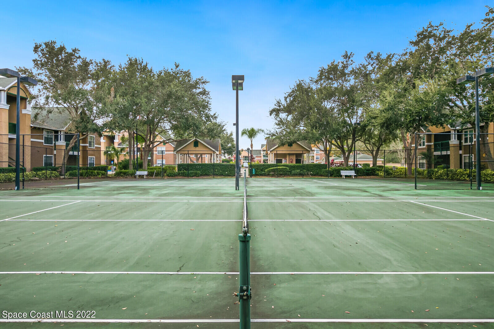 7667 North Wickham Road, Unit 418 Melbourne, FL 32940 - Photo 26 of 36 a view of a tennis court