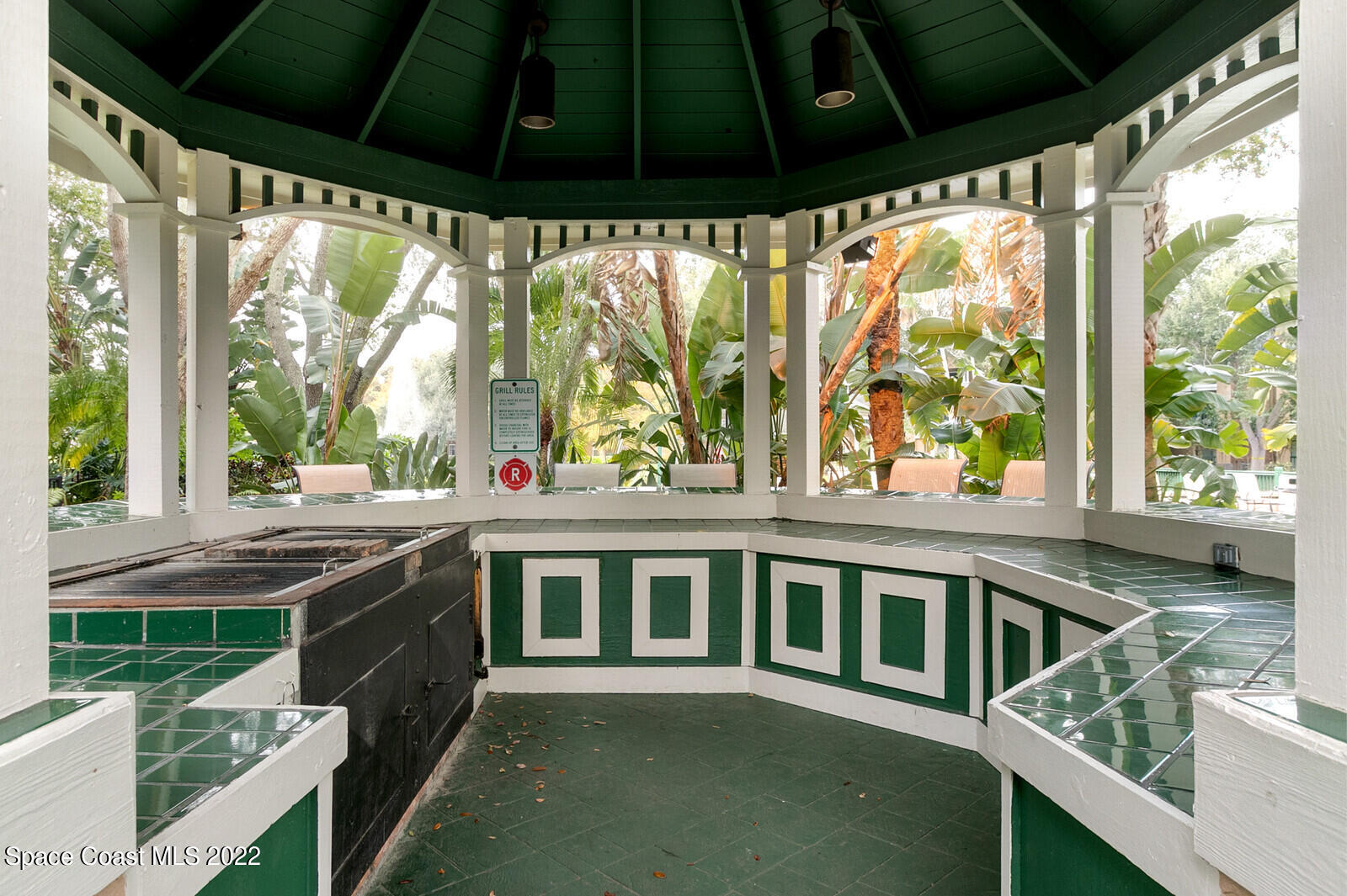 7667 North Wickham Road, Unit 418 Melbourne, FL 32940 - Photo 30 of 36 a view of a porch and garden