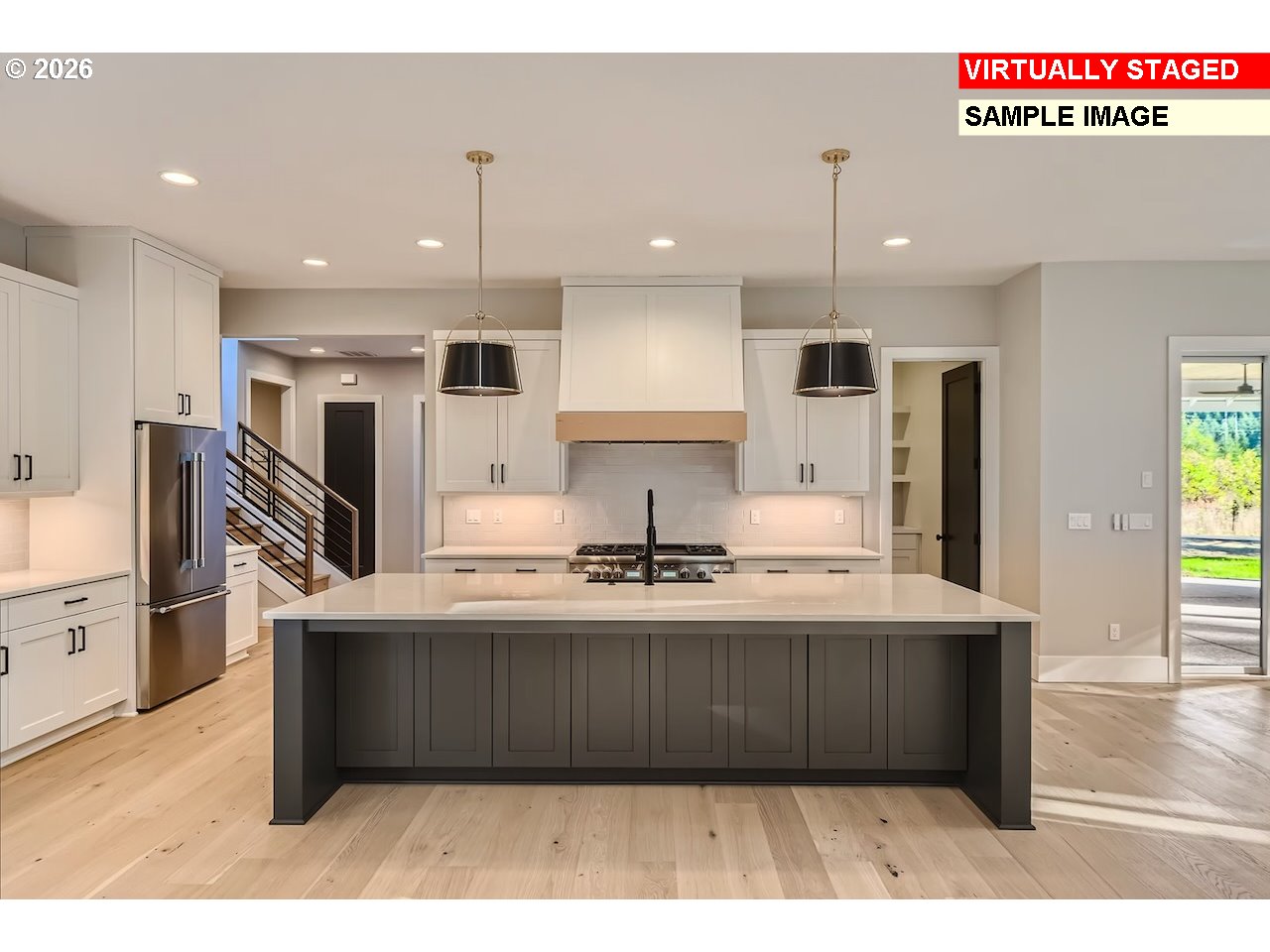 7975 Southwest 82nd Avenue Portland, OR 97223 - Photo 4 of 7 a kitchen with kitchen island stainless steel appliances a sink a counter top space cabinets and a window