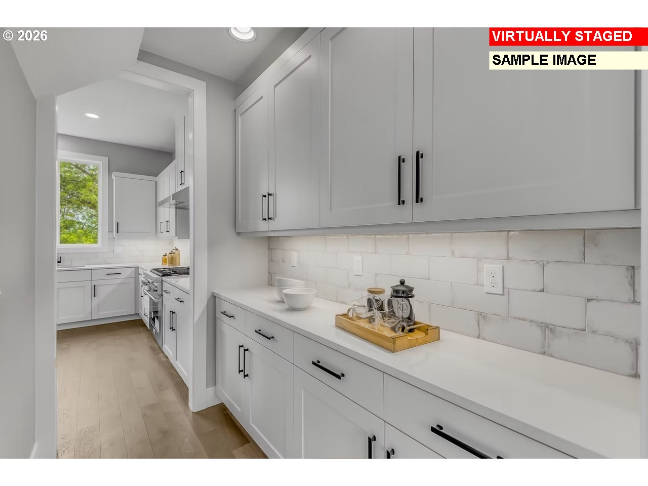 7975 Southwest 82nd Avenue Portland, OR 97223 - Photo 6 of 7 a kitchen with a sink dishwasher and cabinets