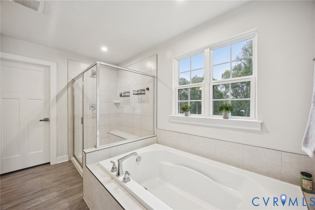 10237 Centralia Sta Road Chester, VA 23831 - Photo 19 of 35 a bathroom with a bathtub and a shower