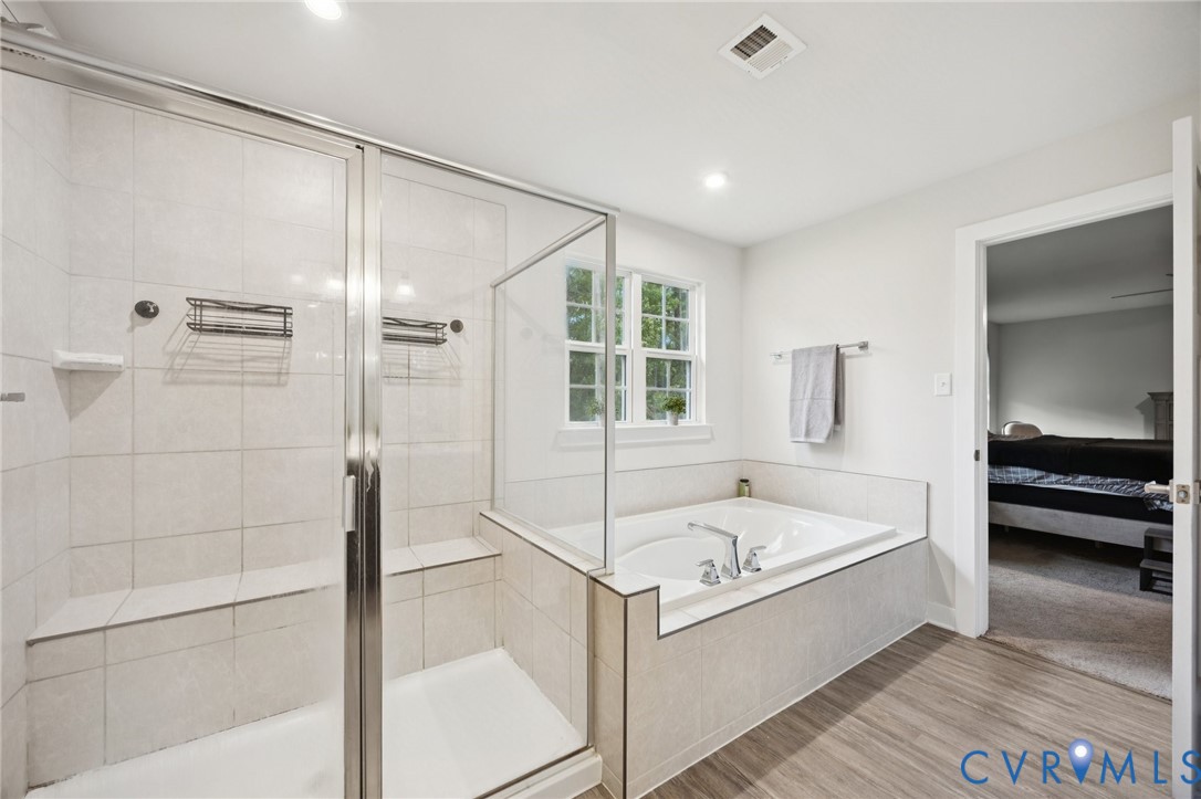 10237 Centralia Sta Road Chester, VA 23831 - Photo 20 of 35 a bathroom with a tub and a shower