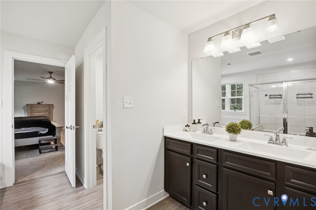 10237 Centralia Sta Road Chester, VA 23831 - Photo 21 of 35 a en suite bathroom with a sink double vanity and a mirror