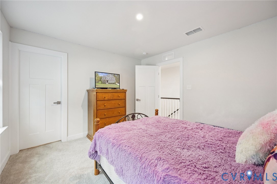 10237 Centralia Sta Road Chester, VA 23831 - Photo 25 of 35 a bedroom with a bed and cabinets