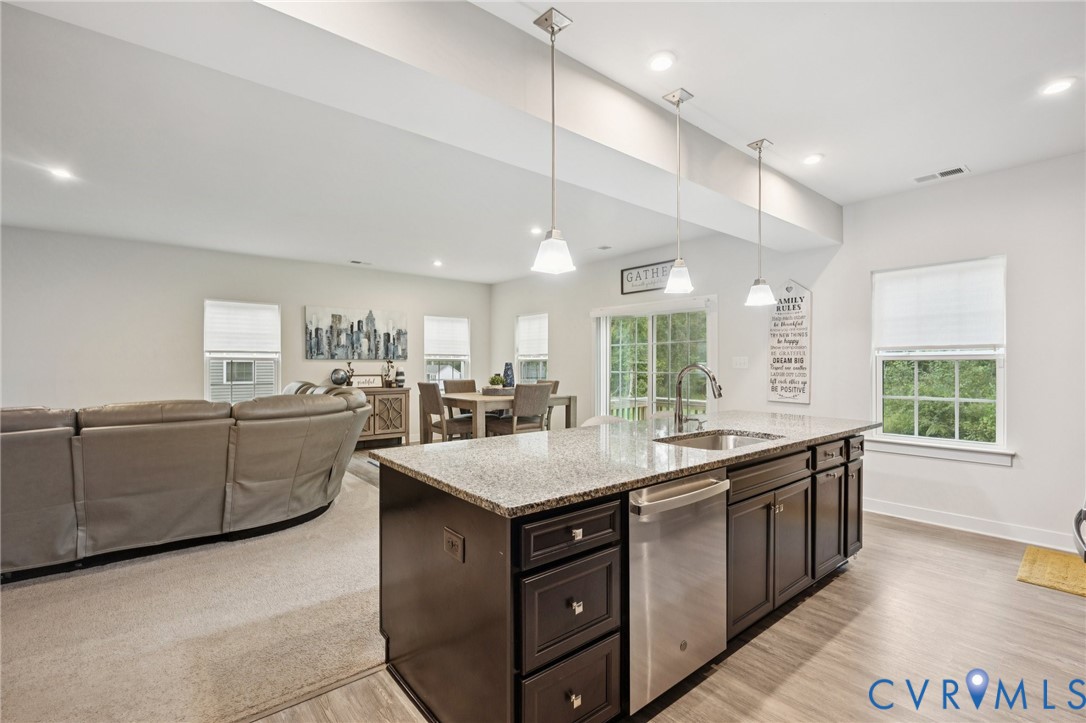 10237 Centralia Sta Road Chester, VA 23831 - Photo 6 of 35 a kitchen with kitchen island granite countertop a sink counter top space and stainless steel appliances