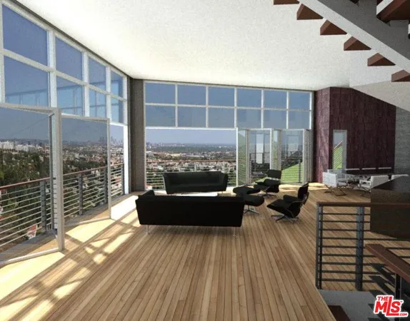 a view of a balcony with couch and wooden floor