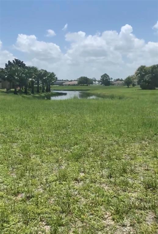 a view of a lake with a big yard