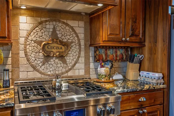 a kitchen with a stove and cabinets