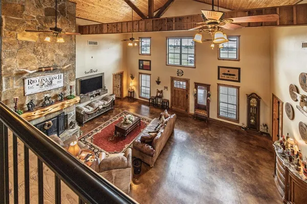 a view of a living room with furniture and a flat screen tv