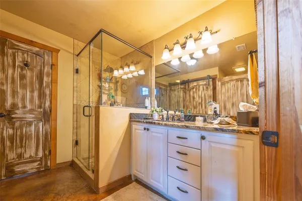 a bathroom with a double vanity sink mirror and double