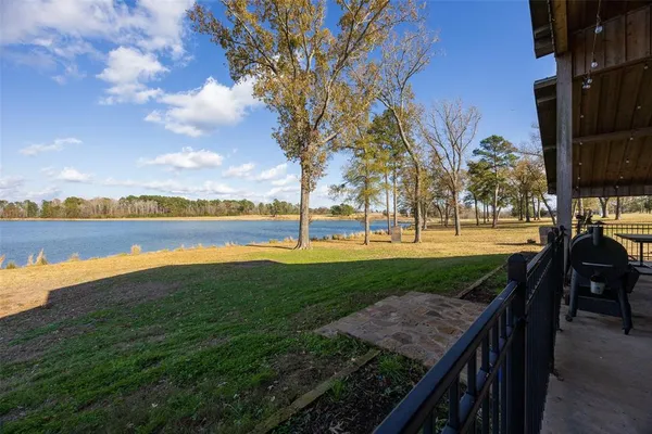 a view of a lake with a yard