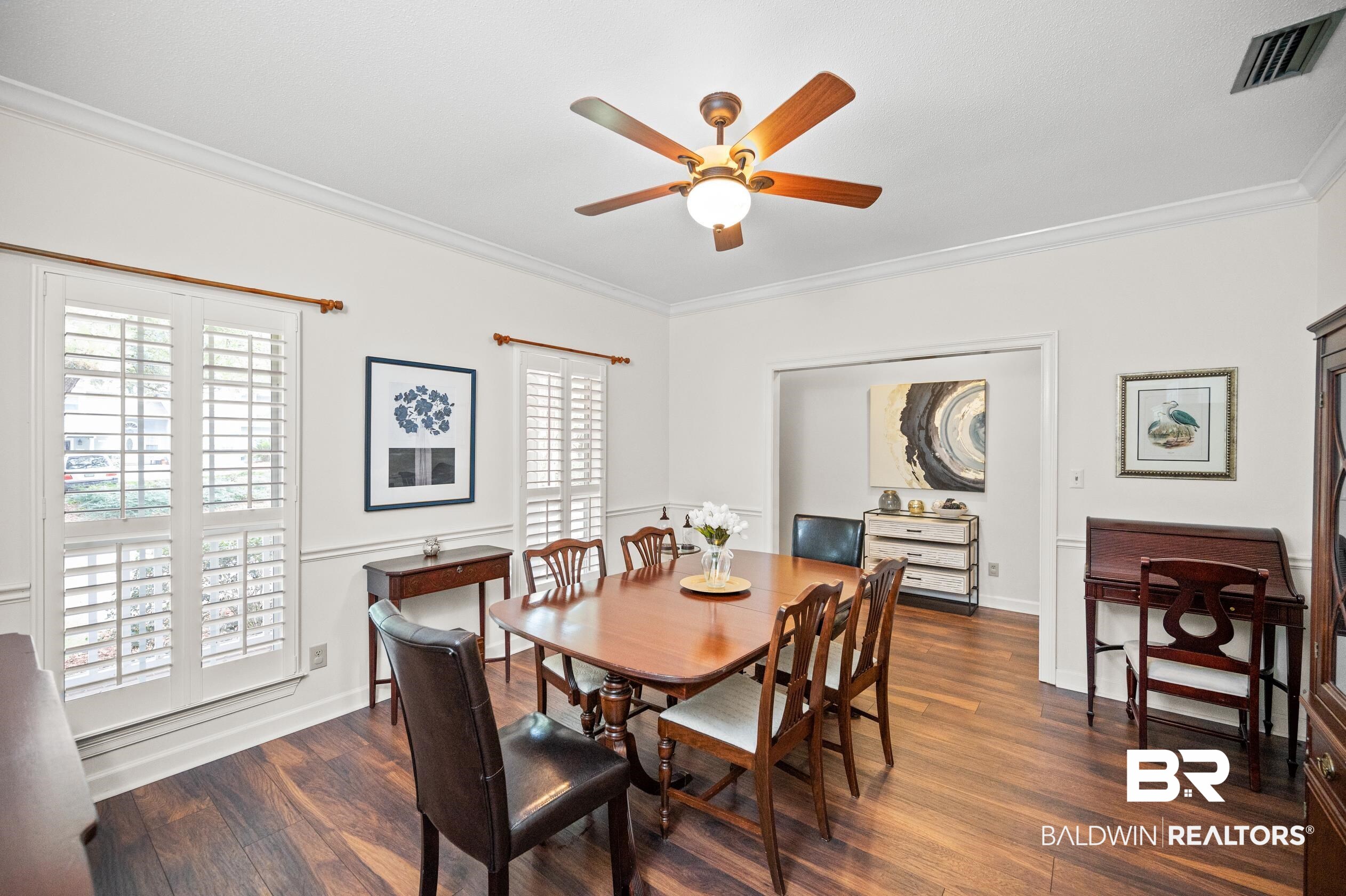 6638 Jackson Square Daphne, AL 36526 - Photo 11 of 62 Dining room featuring dark wood-type flooring, crown molding, and ceiling fan