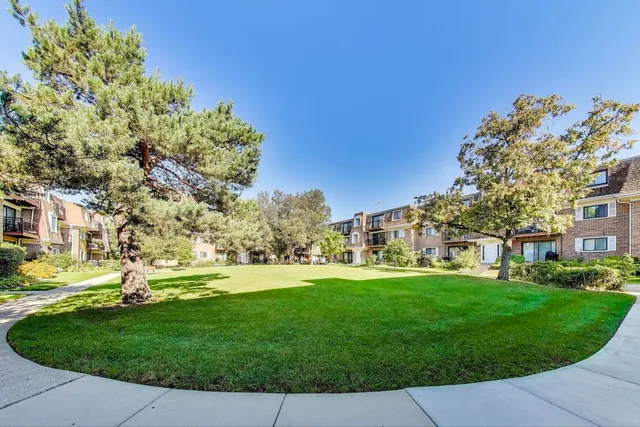 front view of a building with a garden