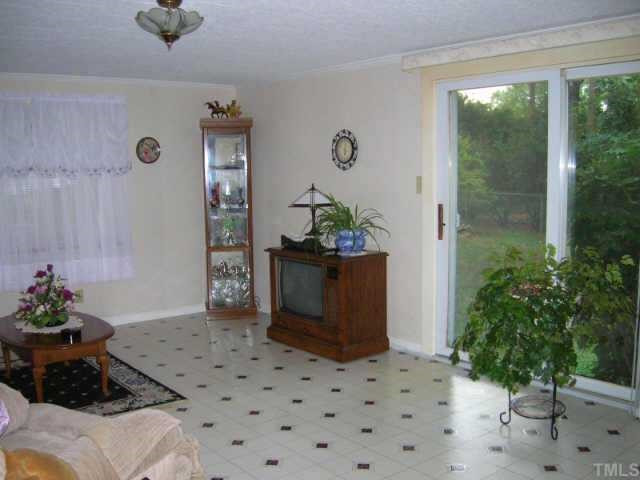 417 Harvard Street Raleigh, NC 27609 - Photo 5 of 9 Bright and spacious family room with sliding glass door that opens to backyard. Other
