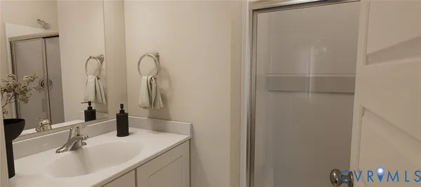a bathroom with a sink and mirror
