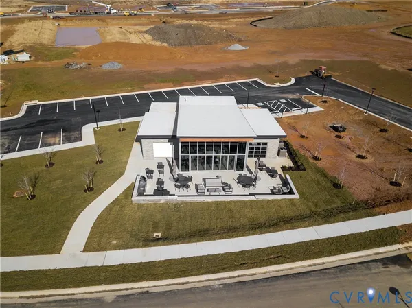 an aerial view of a house with a ocean view