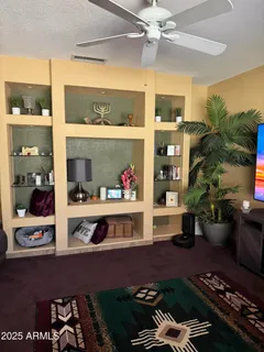a room with furniture and a potted plant
