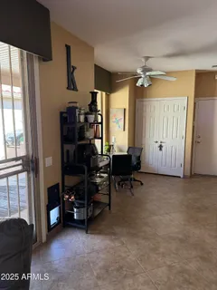 a view of a livingroom with furniture and a window