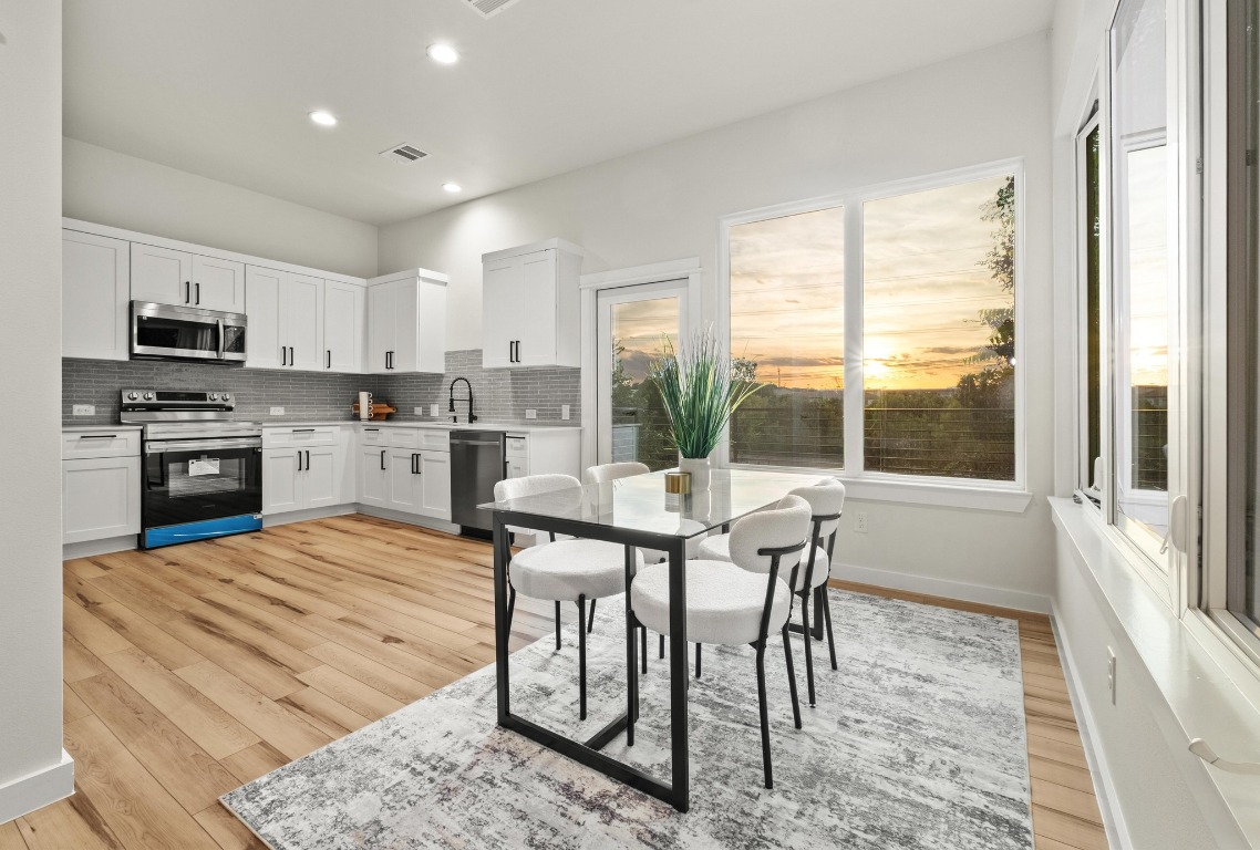 2309 Montopolis Drive, Unit 3 Austin, TX 78741 - Photo 1 of 35 a view of a dining room with furniture window and outside view