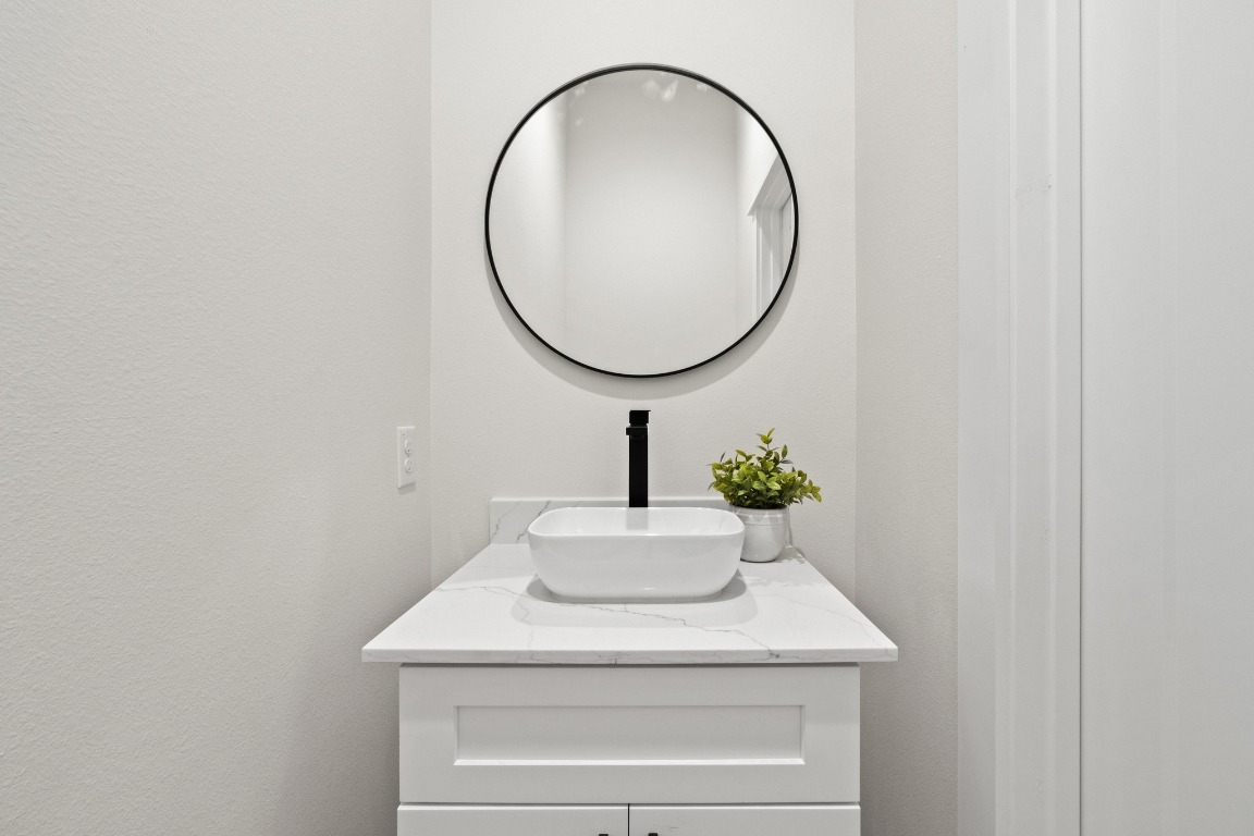 2309 Montopolis Drive, Unit 3 Austin, TX 78741 - Photo 18 of 35 a bathroom with a sink and a mirror