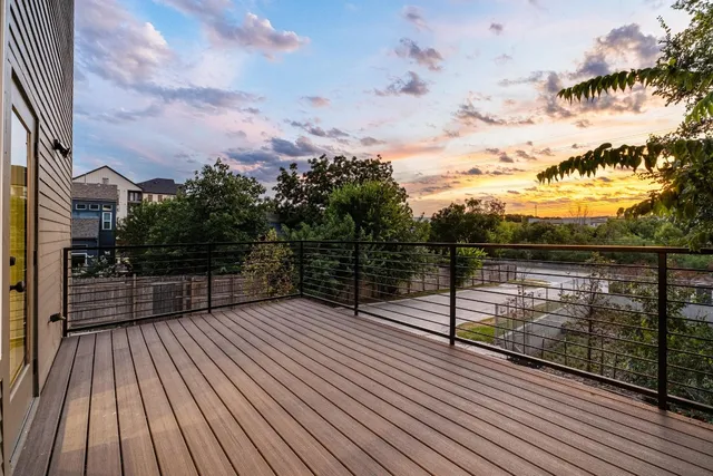 a view of balcony with wooden floor