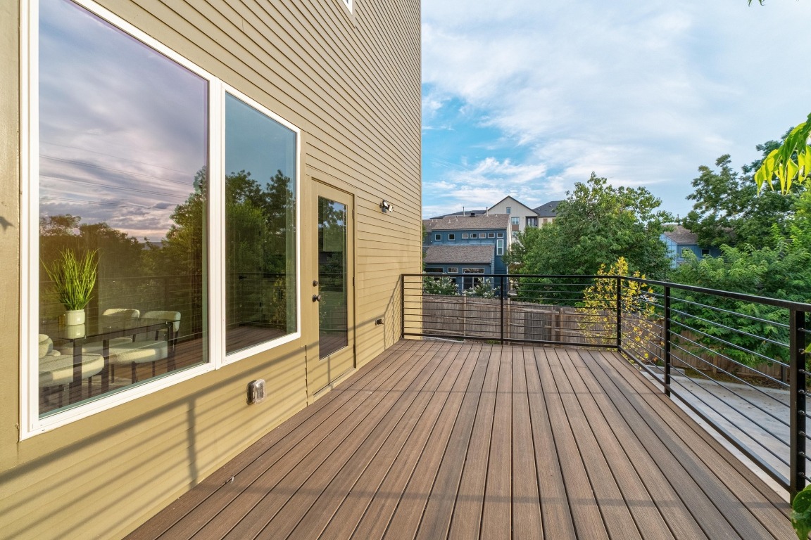 2309 Montopolis Drive, Unit 3 Austin, TX 78741 - Photo 25 of 35 a view of balcony with floor to ceiling windows with wooden floor