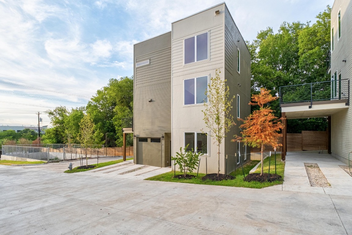 2309 Montopolis Drive, Unit 3 Austin, TX 78741 - Photo 29 of 35 a view of a house with backyard and a tree