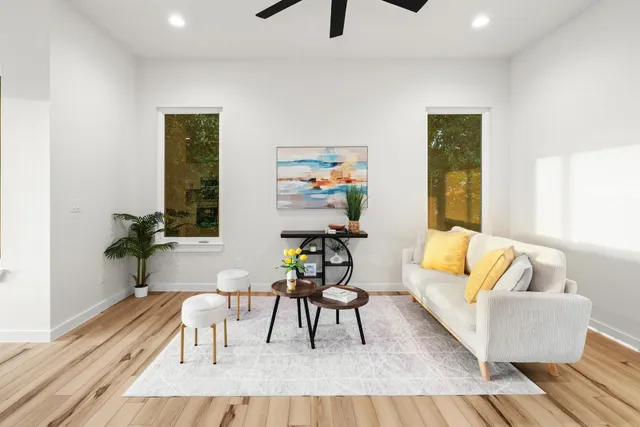 a living room with furniture and a rug