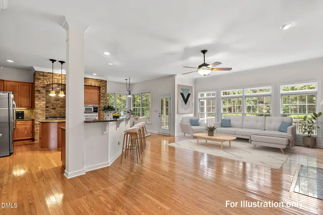 a large kitchen with kitchen island a large counter space and stainless steel appliances
