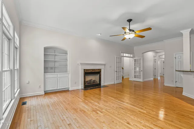 a kitchen with kitchen island a counter top space a sink stainless steel appliances and cabinets