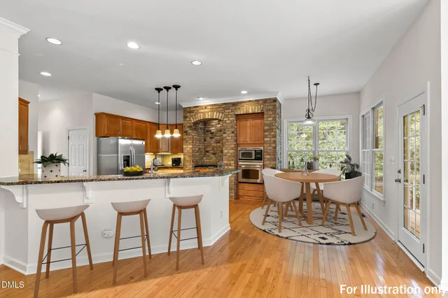 a kitchen with granite countertop a sink and a stove
