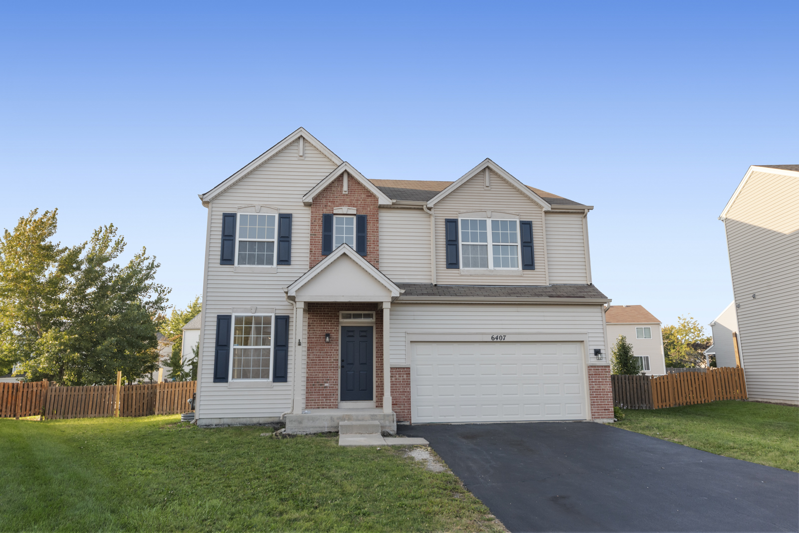 6407 Coyote Ridge Court Plainfield, IL 60586 - Photo 1 of 24 a front view of a house with a yard and garage