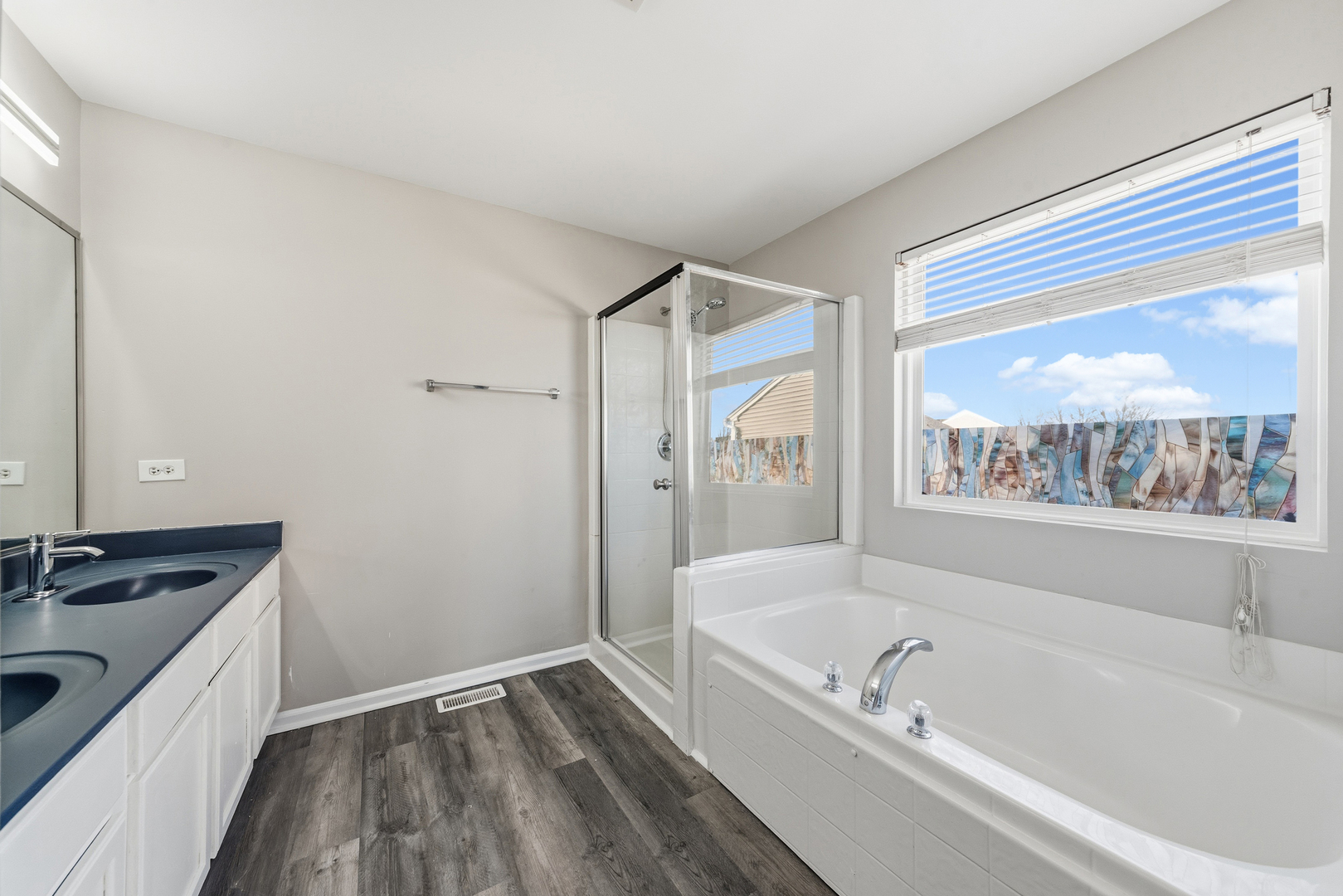 6407 Coyote Ridge Court Plainfield, IL 60586 - Photo 16 of 24 a bathroom with a granite countertop tub sink shower and mirror