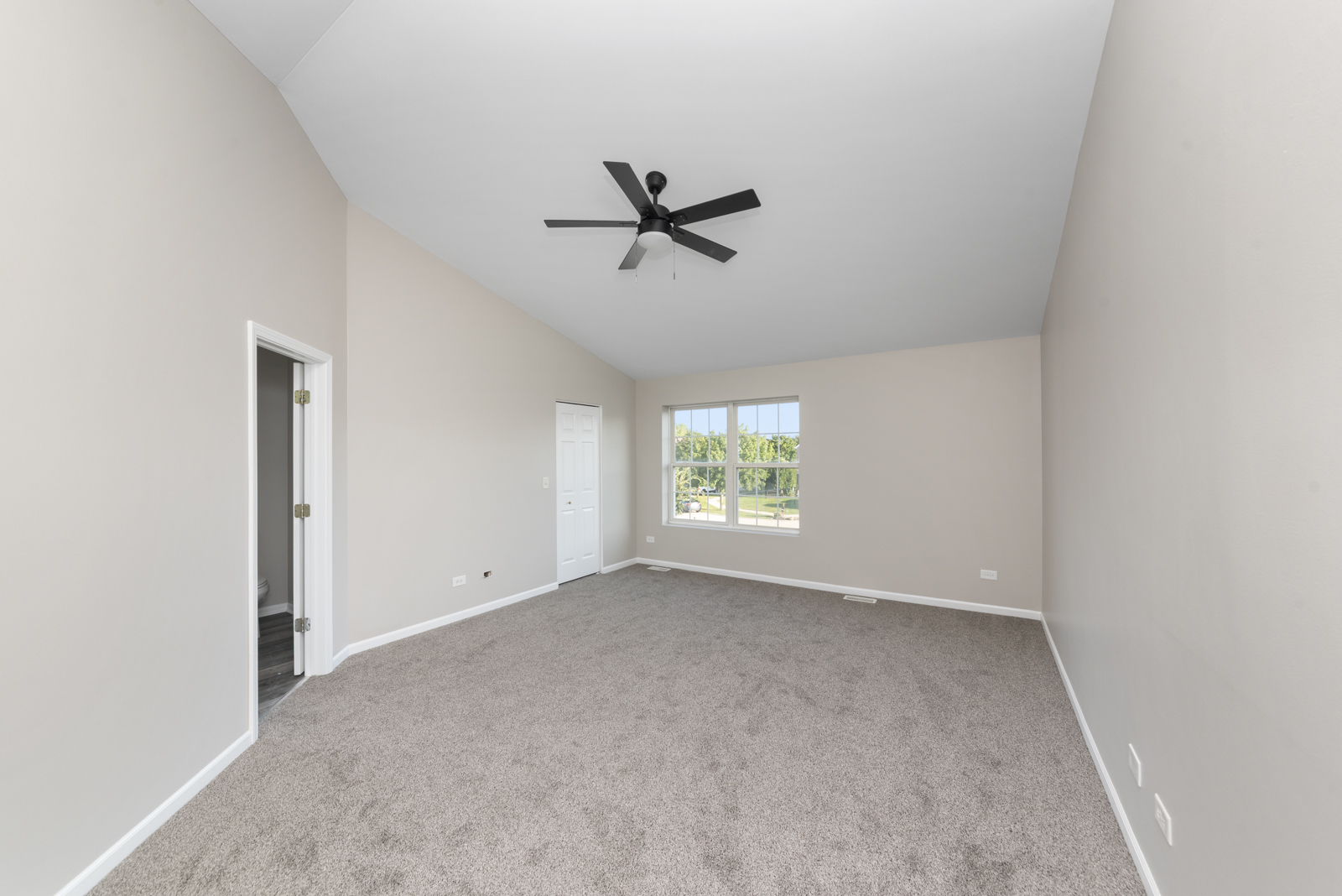 6407 Coyote Ridge Court Plainfield, IL 60586 - Photo 17 of 24 an empty room with windows and fan