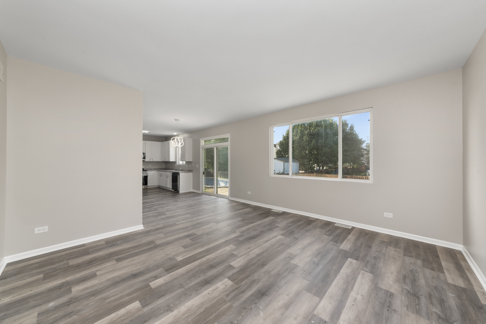 6407 Coyote Ridge Court Plainfield, IL 60586 - Photo 8 of 24 a view of empty room with wooden floor and window