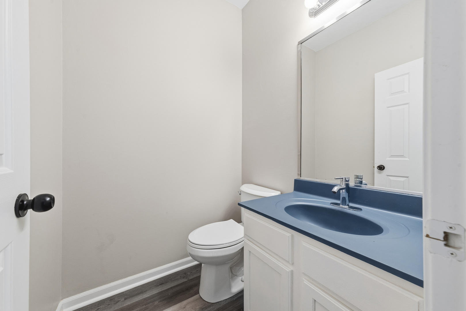 6407 Coyote Ridge Court Plainfield, IL 60586 - Photo 9 of 24 a bathroom with a granite countertop sink a toilet and a mirror