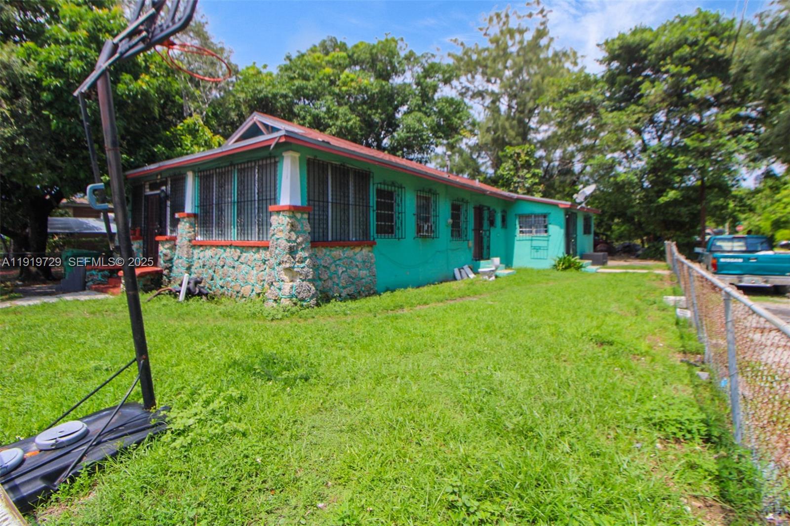 105 Northwest 58th Street Miami, FL 33127 - Photo 2 of 8 a view of a house with a yard