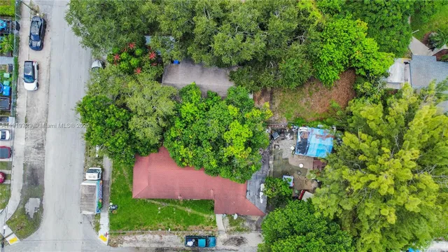 an aerial view of a house with pool outdoor seating and yard