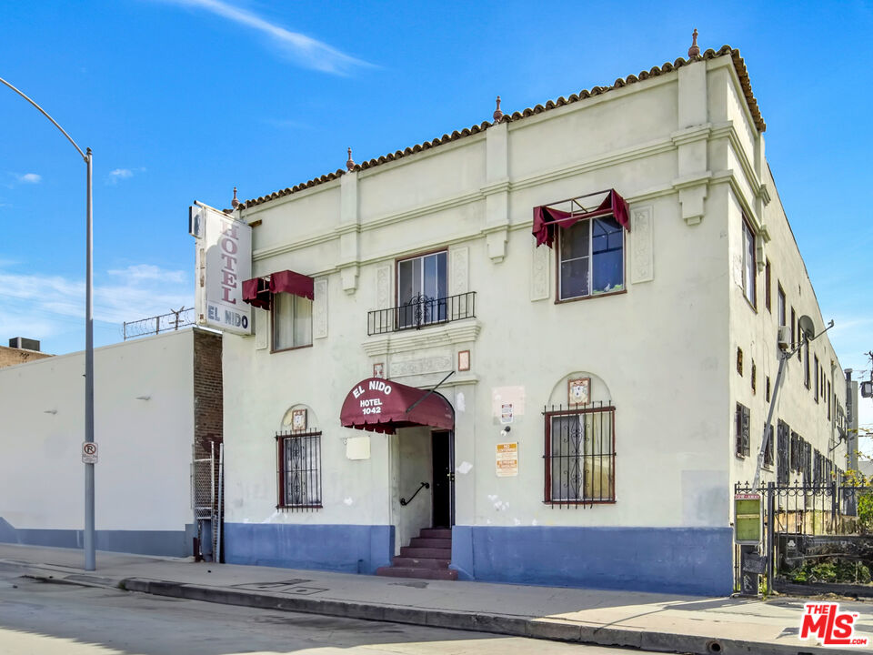 1042 Wilcox Avenue Los Angeles, CA 90038 - Photo 2 of 24 a front view of a house with a garage