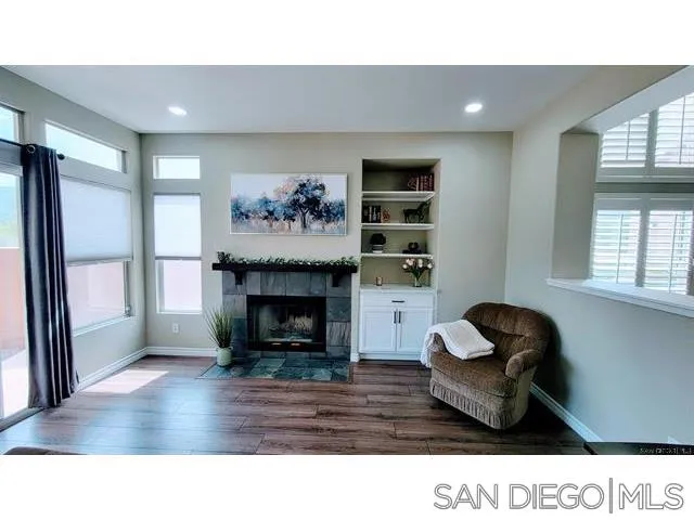 2476 Fallbrook Place Escondido, CA 92027 - Photo 14 of 33 a living room with furniture and a fireplace