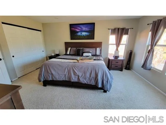 2476 Fallbrook Place Escondido, CA 92027 - Photo 17 of 33 a bedroom with a bed and a window