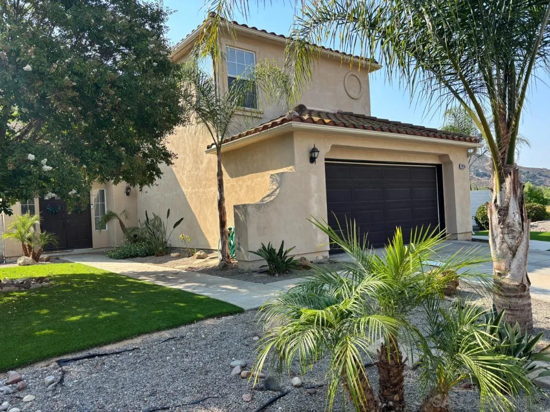 2476 Fallbrook Place Escondido, CA 92027 - Photo 2 of 33 a front view of a house with garden