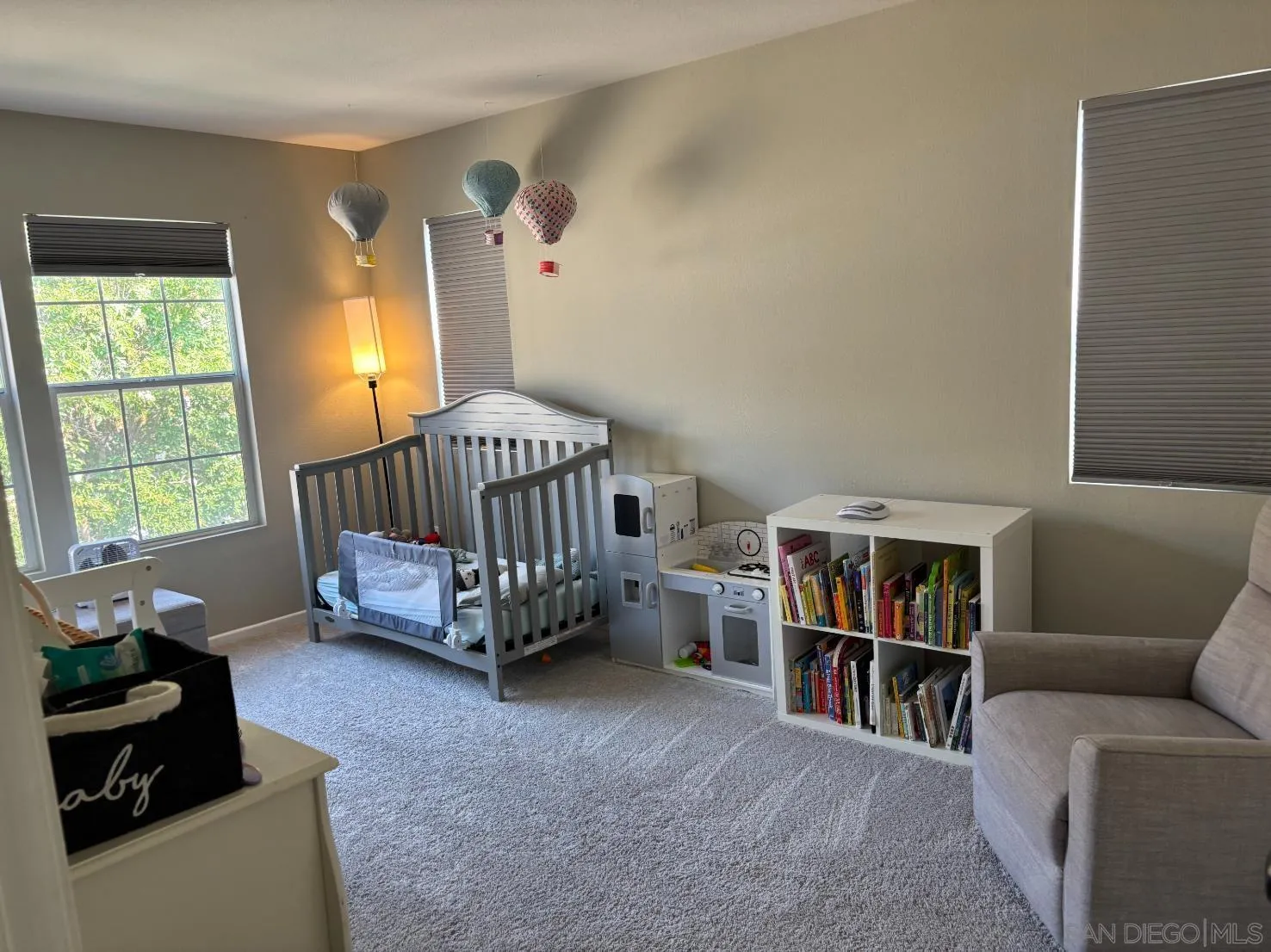 2476 Fallbrook Place Escondido, CA 92027 - Photo 23 of 33 a bedroom with furniture and a book shelf