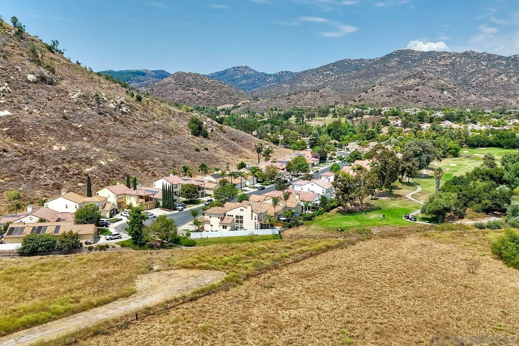 2476 Fallbrook Place Escondido, CA 92027 - Photo 30 of 33 a view of a town with mountains in the background