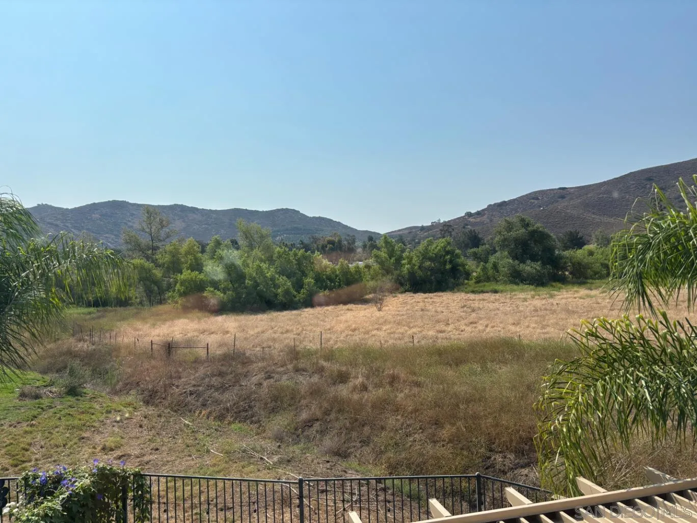 2476 Fallbrook Place Escondido, CA 92027 - Photo 3 of 33 a view of a dry yard with mountains in the background