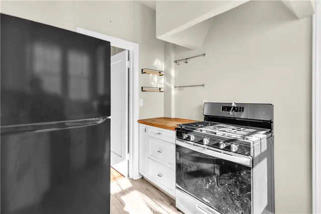 a kitchen with a stove and a refrigerator