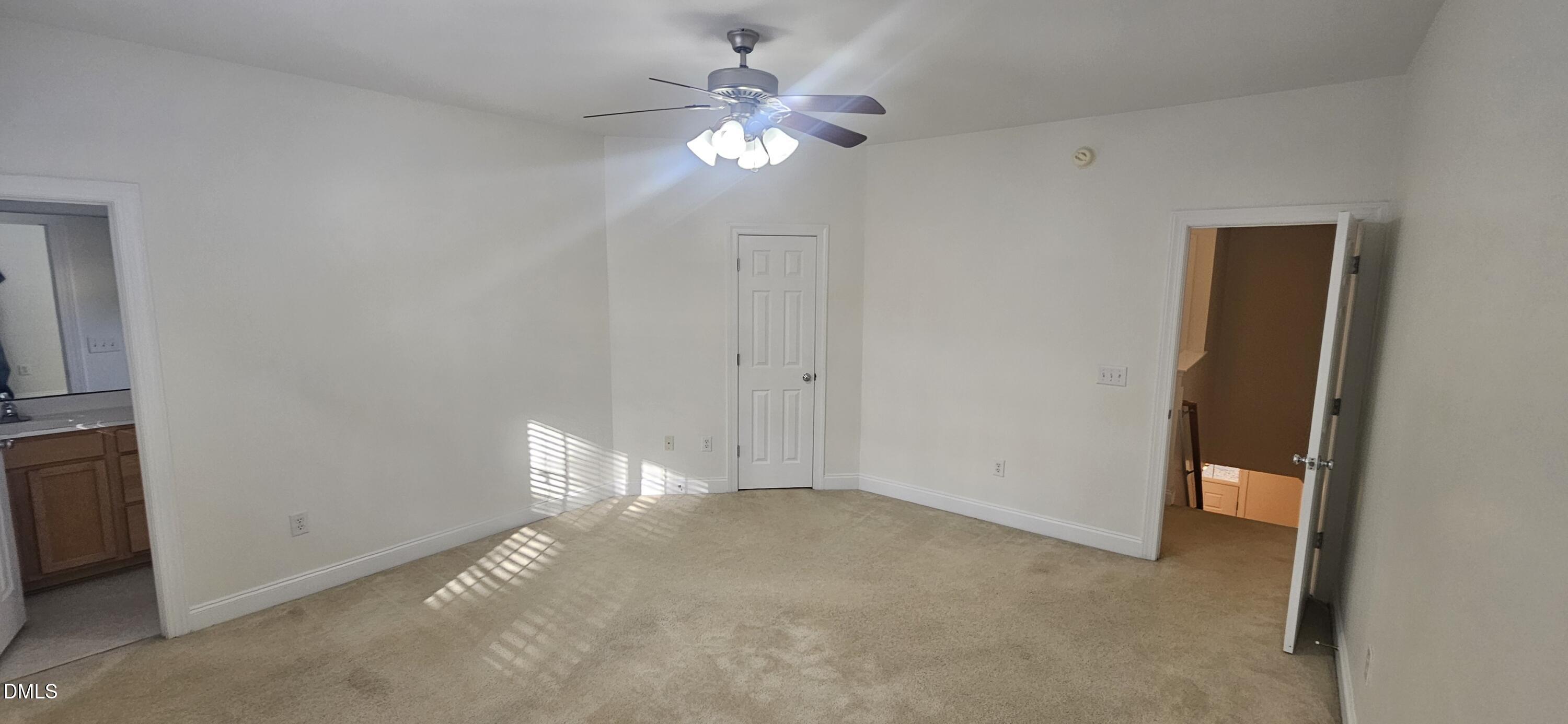 138 West Savannah Ridge Road Holly Springs, NC 27540 - Photo 11 of 22 a view of an empty room with a fan