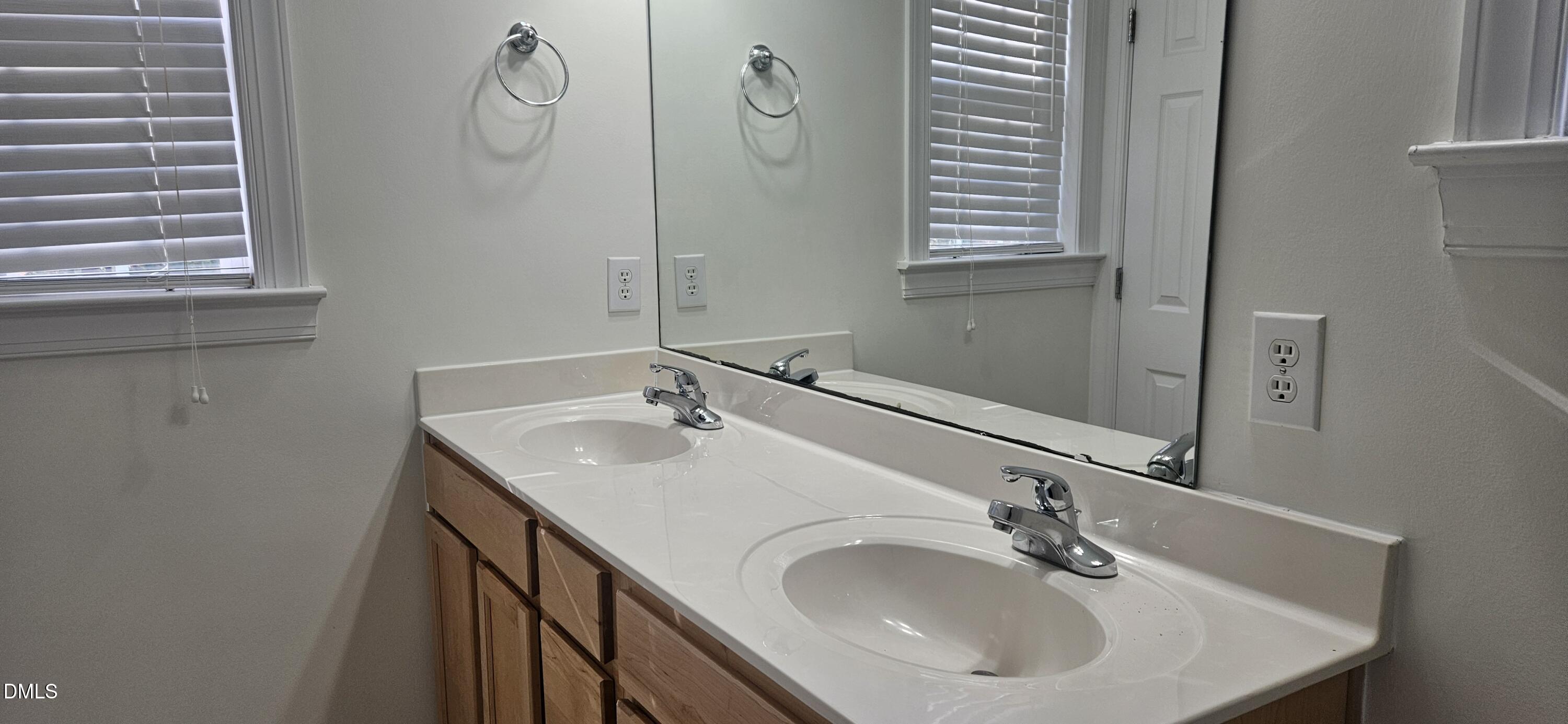 138 West Savannah Ridge Road Holly Springs, NC 27540 - Photo 14 of 22 a bathroom with a sink and a mirror